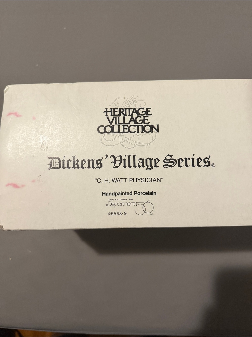 Department 56 White Box with Black Typography and Pink Marks